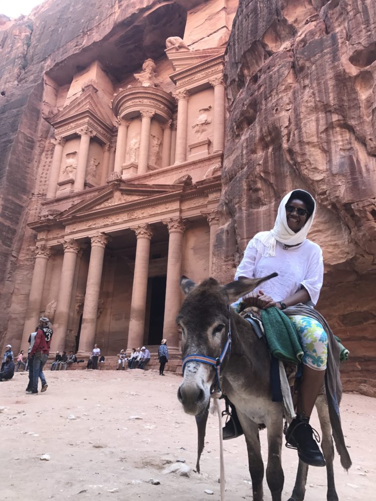 sitting on a donkey at Petra